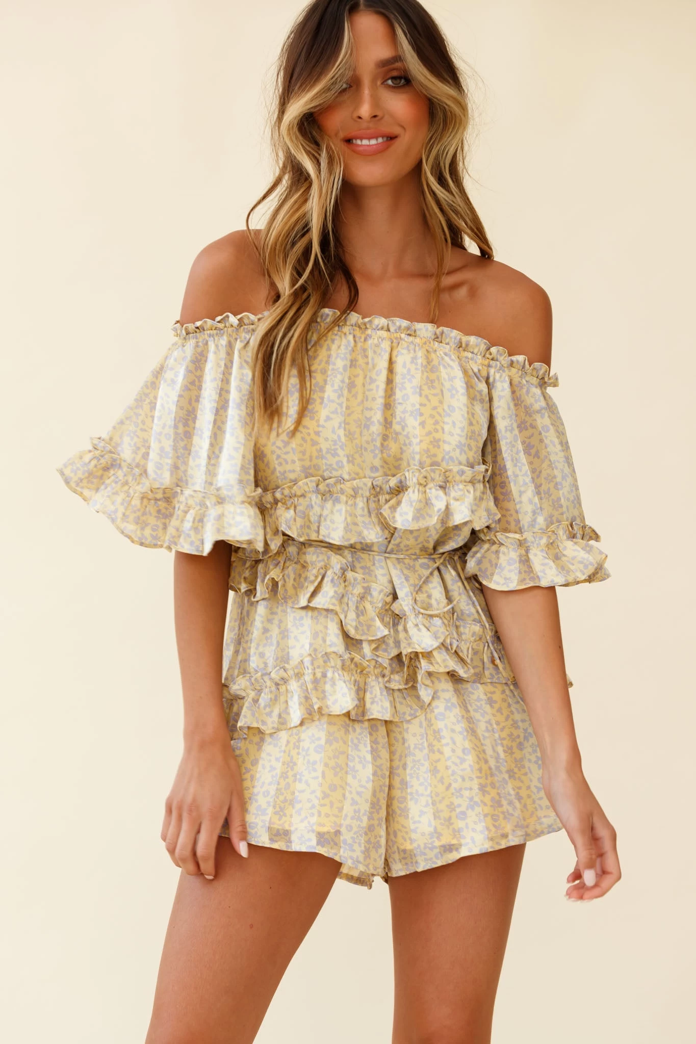 Astoria Bardot Neckline Frill Romper Floral & Stripe Print Yellow 1 Astoria Bardot Neckline Frill Romper Floral & Stripe Print Yellow